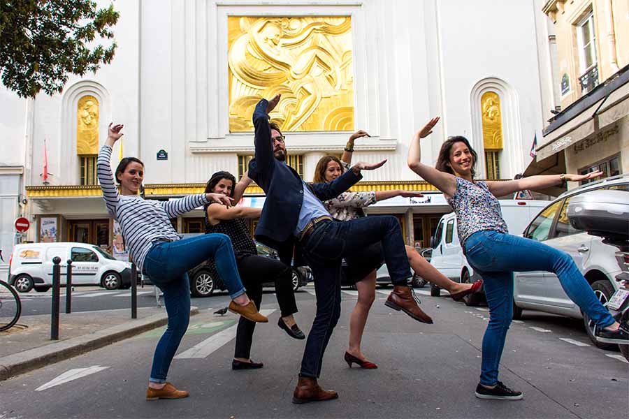 Team Building activity in the Paris Opera district in front of the Folies Bergères Theater