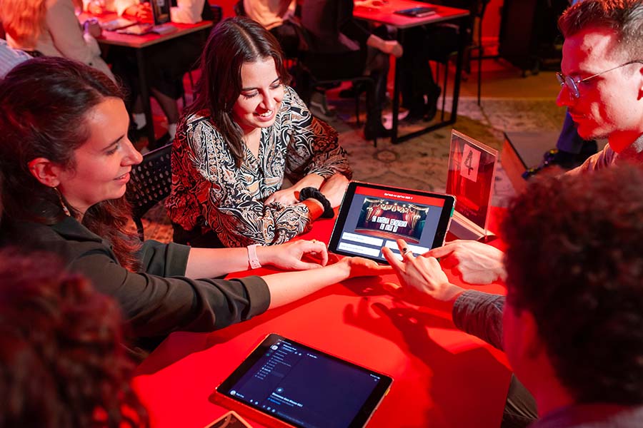 Artificial intelligence quiz on tablets during team building
